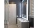 Bathroom with modern vanity and lighted mirror at 1895 Henley Way, Alpharetta, GA 30009