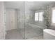 Elegant bathroom with a large glass shower, a marble bench, and a rain shower head at 1895 Henley Way, Alpharetta, GA 30009