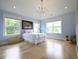 Light blue bedroom featuring natural light, hardwood flooring, and a twin bed at 1895 Henley Way, Alpharetta, GA 30009