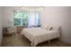 Cozy bedroom with natural light, hardwood floors, and a comfortable bed at 1895 Henley Way, Alpharetta, GA 30009