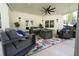Covered outdoor patio with comfortable seating, a floral rug, and stylish decor, perfect for relaxation at 1895 Henley Way, Alpharetta, GA 30009