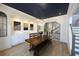 Dining area with a dark ceiling, stylish light fixture, and hardwood floors at 1895 Henley Way, Alpharetta, GA 30009
