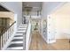 Elegant foyer with hardwood floors, stairs leading to the second floor, and an open floor plan at 1895 Henley Way, Alpharetta, GA 30009