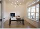 Bright home office with ample natural light, a modern desk, and stylish lighting for a productive workspace at 1895 Henley Way, Alpharetta, GA 30009