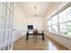 Bright office with natural light from large windows, a modern desk, and hardwood floors at 1895 Henley Way, Alpharetta, GA 30009