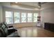 Media room with theater seating, large windows with wooded view, and a snack bar at 1895 Henley Way, Alpharetta, GA 30009