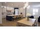 Modern kitchen features a large center island, hardwood floors, and stylish pendant lighting at 1895 Henley Way, Alpharetta, GA 30009