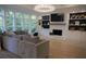 Bright living room with large windows, built-in shelving, and a cozy fireplace at 1895 Henley Way, Alpharetta, GA 30009