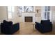 Cozy living room featuring built-in bookshelves, fireplace, and comfortable seating at 1895 Henley Way, Alpharetta, GA 30009