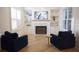Inviting living room features a fireplace flanked by custom built-ins and stylish seating at 1895 Henley Way, Alpharetta, GA 30009