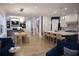 Open-concept living space with hardwood floors, pendant lighting, and comfortable seating area at 1895 Henley Way, Alpharetta, GA 30009