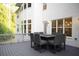 Spacious outdoor dining area on a gray deck with seating for eight people at 1895 Henley Way, Alpharetta, GA 30009