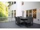 Outdoor dining area on a deck with a table and chairs, offering a great space for entertaining at 1895 Henley Way, Alpharetta, GA 30009