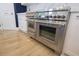 High-end stainless steel oven with double doors and white cabinets at 1895 Henley Way, Alpharetta, GA 30009