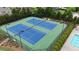 Aerial view of two blue tennis courts surrounded by green space, bushes, trees, and pool at 1895 Henley Way, Alpharetta, GA 30009
