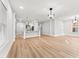 Open concept living area with wood floors, kitchen island, and lots of natural light at 2128 Hosea L Williams Ne Dr, Atlanta, GA 30317