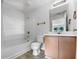 Bright bathroom features a tub and shower combination with updated fixtures and vanity at 3217 Fairington Dr, Lithonia, GA 30038