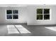 Bedroom with two windows offering views of the surrounding neighborhood at 3217 Fairington Dr, Lithonia, GA 30038