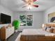 Inviting bedroom with modern furniture, neutral tones, and a window overlooking lush greenery at 3217 Fairington Dr, Lithonia, GA 30038