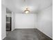 Cozy dining area with gray carpet and a view into kitchen featuring stainless steel refrigerator at 3217 Fairington Dr, Lithonia, GA 30038