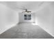 Spacious room with neutral carpet, ceiling fan, and a view of neighborhood at 3217 Fairington Dr, Lithonia, GA 30038