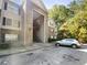 A two-story condo building with brick facade and well-maintained landscaping at 3217 Fairington Dr, Lithonia, GA 30038