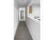 Hallway with neutral walls and carpet leading to a room with natural light at 3217 Fairington Dr, Lithonia, GA 30038