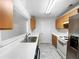 Well-lit kitchen boasts modern appliances, white countertops, and tile flooring at 3217 Fairington Dr, Lithonia, GA 30038