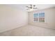 Bright bedroom with neutral walls, carpet, and a window allowing natural light to flood the room at 522 Spring View Dr, Woodstock, GA 30188