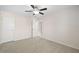 Bedroom features neutral carpet, paint and ceiling fan at 522 Spring View Dr, Woodstock, GA 30188