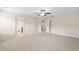 Spacious bedroom with neutral carpet, paint and ceiling fan at 522 Spring View Dr, Woodstock, GA 30188