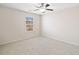 Bright bedroom with neutral paint, carpet, and ceiling fan at 522 Spring View Dr, Woodstock, GA 30188