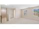 Bright hallway features neutral paint and carpet, natural light from two windows at 522 Spring View Dr, Woodstock, GA 30188