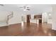 Spacious open-concept area connecting the living room and kitchen with hardwood floors and natural light at 522 Spring View Dr, Woodstock, GA 30188