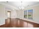 Formal living room boasting refined crown molding, hardwood floors, and abundant natural light from the large windows at 522 Spring View Dr, Woodstock, GA 30188