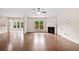 Expansive living room with a fireplace, hardwood floors, and views of the backyard at 522 Spring View Dr, Woodstock, GA 30188