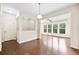 Open living space with hardwood floors, an abundance of natural light, and seamless flow into adjacent areas at 522 Spring View Dr, Woodstock, GA 30188
