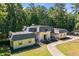 Bird's eye view of charming residence, showcasing surrounding greenery at 2023 Stoneleigh Dr, Stone Mountain, GA 30087