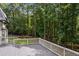 Elevated back deck with white railings overlooking a lush wooded area at 2023 Stoneleigh Dr, Stone Mountain, GA 30087