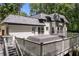 Large back deck with multiple levels offering scenic views of the surrounding landscape at 2023 Stoneleigh Dr, Stone Mountain, GA 30087