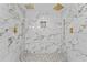 This lavish bathroom features dual shower heads and stylish marble-patterned walls for a spa-like experience at 2023 Stoneleigh Dr, Stone Mountain, GA 30087