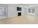 The living room includes a fireplace, natural light, and sleek flooring, enhancing the home's comfort at 2023 Stoneleigh Dr, Stone Mountain, GA 30087