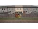 A view of the backyard showing the fence, patio, and the rear of the house at 2404 Fitts Dr, Conyers, GA 30094