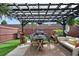 Backyard with patio including a pergola, outdoor seating and grill at 2404 Fitts Dr, Conyers, GA 30094