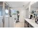 Bright bathroom featuring a glass shower, garden tub, and stylish chandelier at 2404 Fitts Dr, Conyers, GA 30094