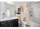 Bright bathroom featuring a modern vanity and shower-tub combination at 2404 Fitts Dr, Conyers, GA 30094