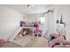 Charming bedroom with a bed and slide, plush toys, and storage at 2404 Fitts Dr, Conyers, GA 30094