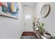 Bright hallway with light walls and a wooden accent table with plants at 2404 Fitts Dr, Conyers, GA 30094