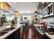 Open kitchen design with stainless appliances, quartz countertops, and adjacent dining area at 2404 Fitts Dr, Conyers, GA 30094