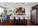 Modern kitchen with stainless steel appliances, a large island, and stylish bar stools at 2404 Fitts Dr, Conyers, GA 30094